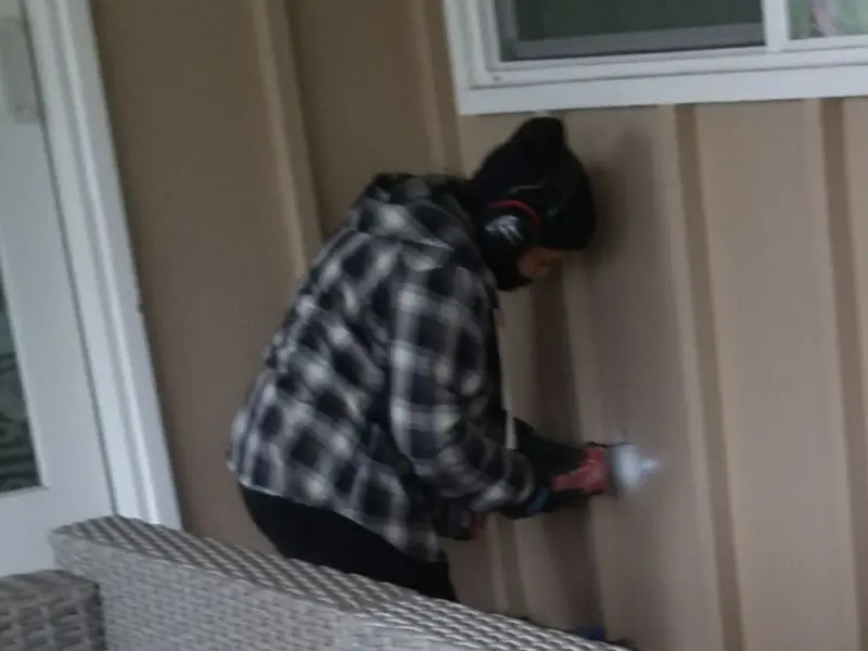 Professional electrician installing an exterior outlet in Jacksboro
